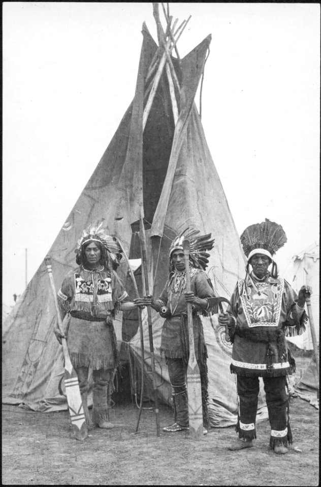 A trio of Indians of the Caughnawaga tribe with decorated… photo
