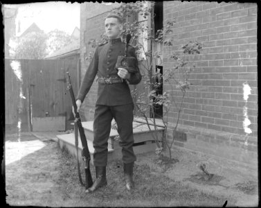 Soldier in uniform with rifle photo