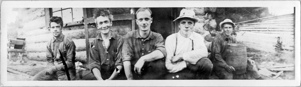 Portrait of [railway construction workers?] at camp