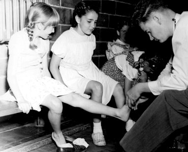 Doctor attending to girls, West Toronto YWCA photo