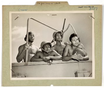 Colored crew of a 20 mm gun aboard a Coast Guard fighting …
