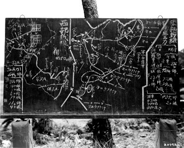 SC 207921 - This blackboard, which kept Jap troops abreast…