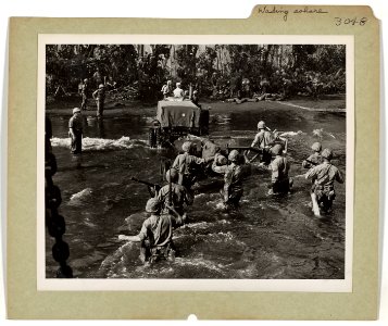 U.S. Marines from a Coast Guard manned landing craft holdi…