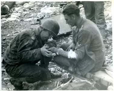 SC 189917-S - An American medical officer treats a wounded… photo