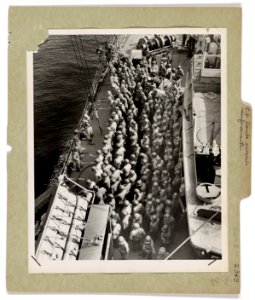 Army troops line up on the deck of a Coast Guard assault t…