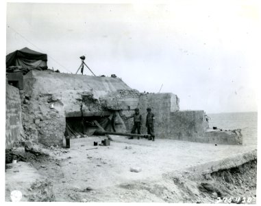 SC 275420 - An American soldier inspects a German pillbox …