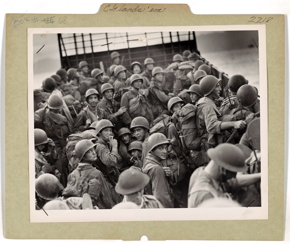 American troops, transferred from a Coast Guard-manned ass…
