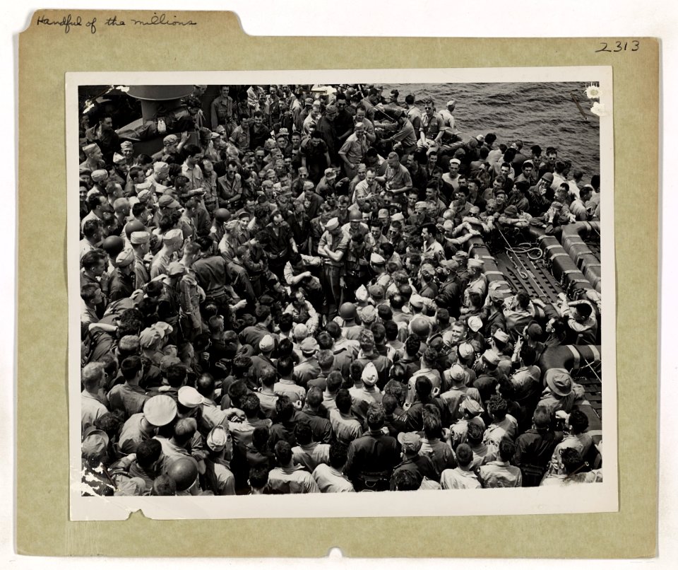 Aboard a Coast Guard-manned assault transport, the decks a…