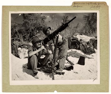 Driven back from the beaches of Saipan, Japanese soldiers …