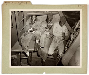 Relaxing aboard a U.S. Coast Guard-manned transport headed…