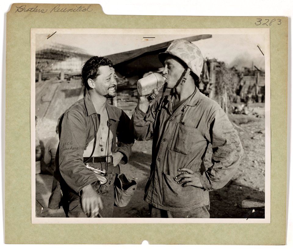 Coast Guard combat artist Sandor Klein (left) and his Mari…