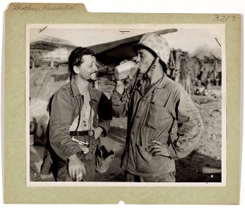 Coast Guard combat artist Sandor Klein (left) and his Mari…