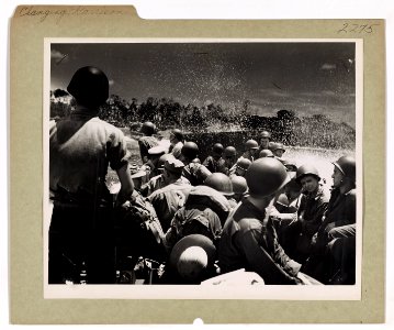 From a Coast Guard-manned assault transport, a party of so…