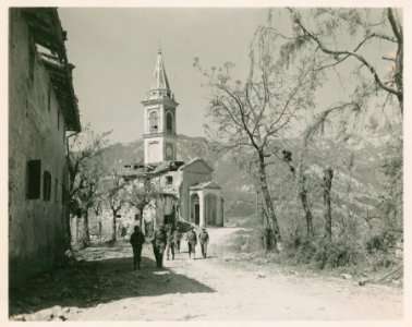 U.S. Communication Troops walk past shell torn church in S…