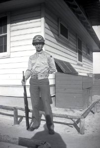 Personal Photo: Serviceman posing stateside next to army b…