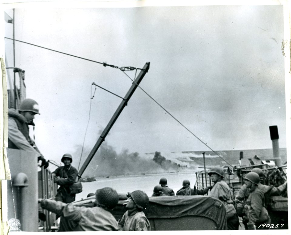 SC 190257 - Smoke pours out of German defenses on Omaha Be…