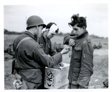 SC 190269 - An American soldier makes out an identity tag …