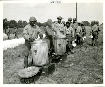 African-American troops line up for a meal at a U.S. Army … photo