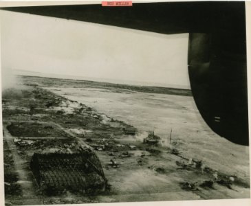 This aerial view of devastated Tinian was taken by a Navy … photo
