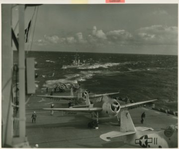 Into the wind Navy warplanes prepare to take off as their … photo