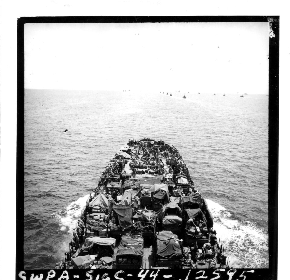 SC 190553-S - *Ship transporting trucks and men in a convo…