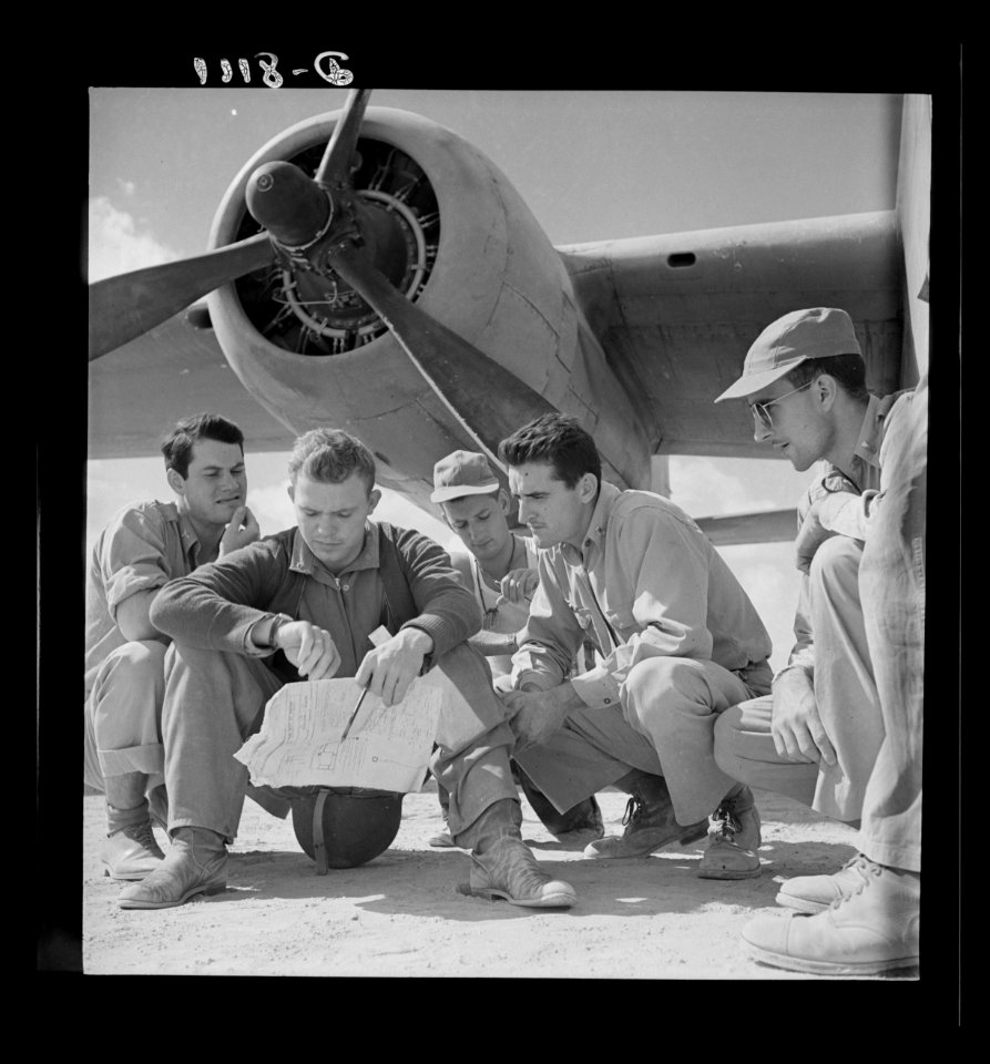 The crew of a U.S. Army Air Force B-25 bomber check their …