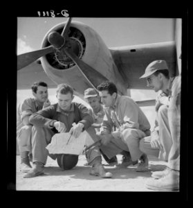 The crew of a U.S. Army Air Force B-25 bomber check their …