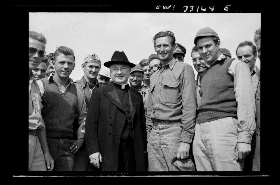 Monsignor Spellman with Corporal George T. Robinson while …