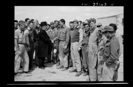 Monsignor Spellman shaking hands with Corporal George T. R…