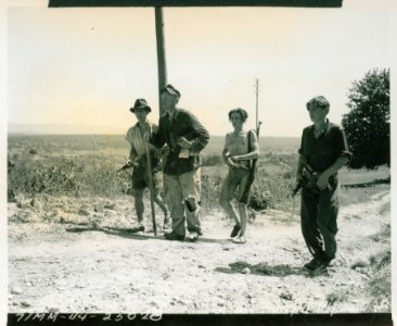 Three members of the French Forces of the Interior helping… photo