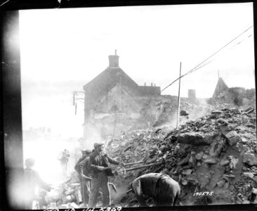 SC 190595 - French peasants help clear the wreckage of war… photo