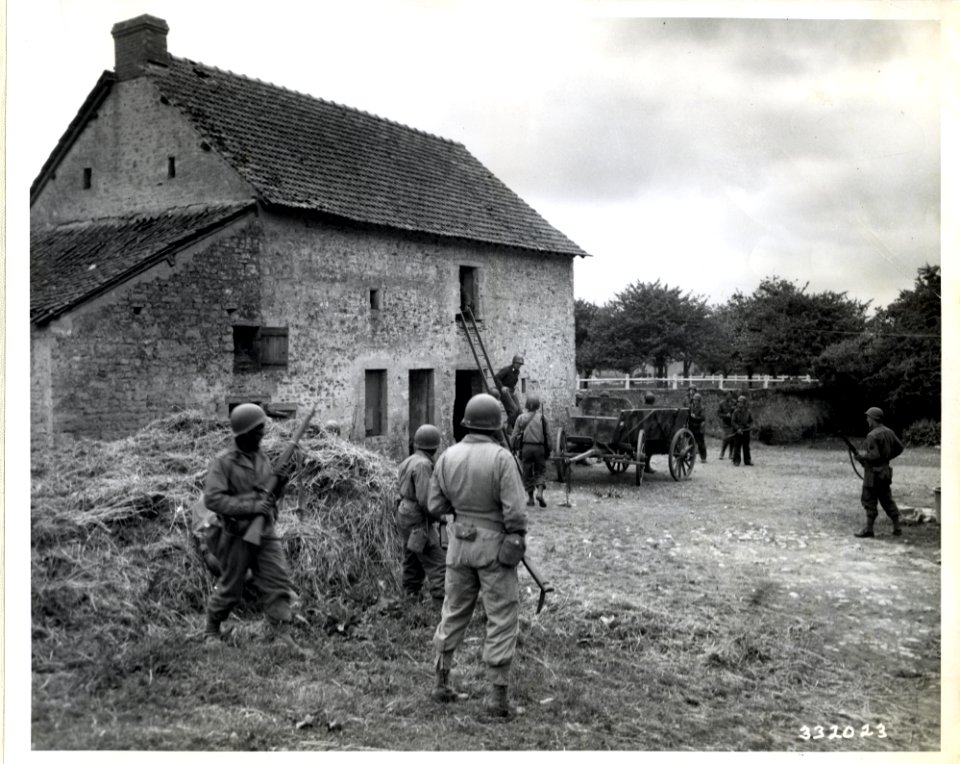 SC 332023 - A platoon of Negro soldiers is led by Cpt. Sam…