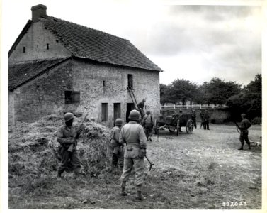 SC 332023 - A platoon of Negro soldiers is led by Cpt. Sam…