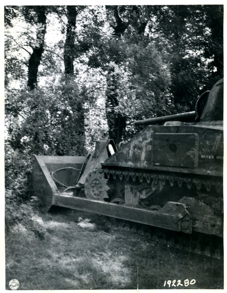 SC 192280 - This U.S. Army tank-dozer is shown ramming a h…