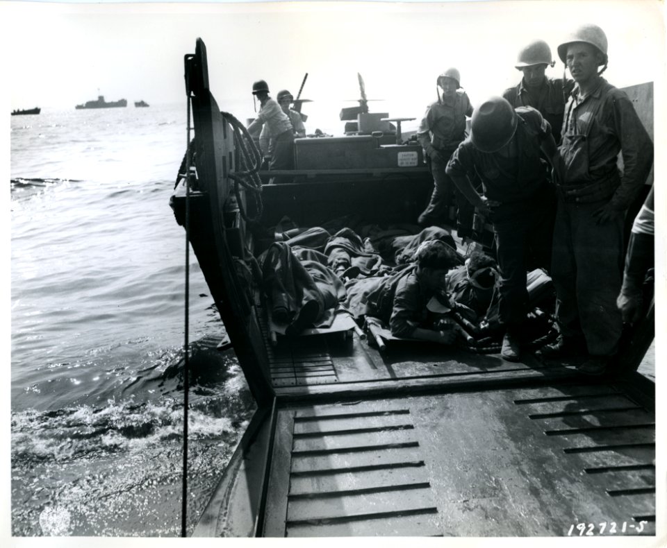 SC 192721-S - Evacuation of wounded on beach into Higgins …