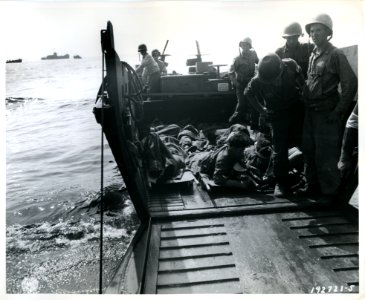 SC 192721-S - Evacuation of wounded on beach into Higgins …