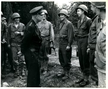 SC 191750-S - General Eisenhower pauses to talk to these G… photo