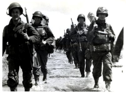 SC 320889 - American troops wade through fields in Norther…