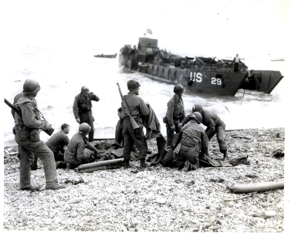 SC 320870 - American troops administer first aid to their …
