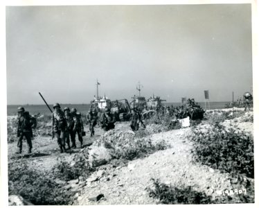 SC 192907 - Allied troops of the 36th Division come ashore…