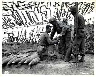 SC 255992 - Yank Artillery men pile up 155-mm ammunition, …