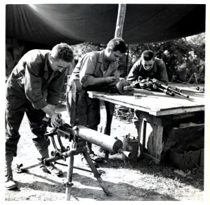 SC 293356 - Men repairing captured weaponry at an ordnance…