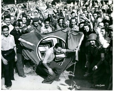 SC 194304 - A crowd at Marseille, France, sets fire to a G…