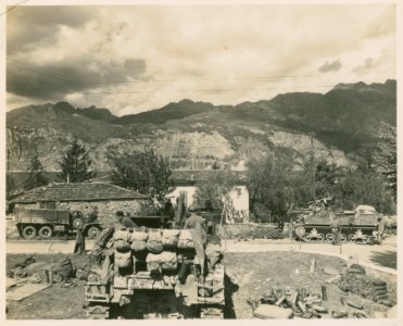 An M-7 of 'A' Battery, 1125th F.A. Bn., fires at a road ac…