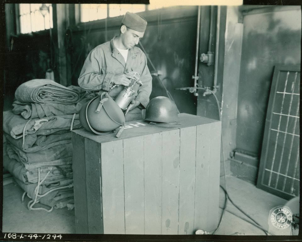 Pfc. D.W. Bramants, San Francisco Calif., sprays a coat of…