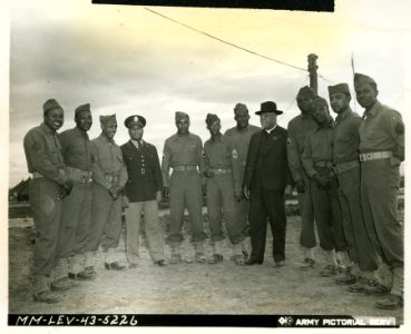 Bishop J. A. Gregg, surrounded by a group of African Ameri…