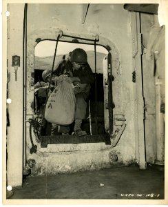 7th Division men entering the troop transport with their b… photo
