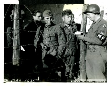 Sgt. Edwin Henson, San Jose, Cal., checks identification t…