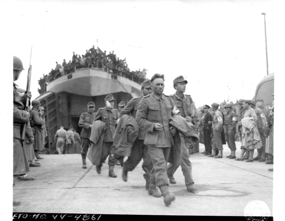 SC 190470 - U.S. Military Police stand guard as a load of …