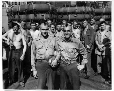 Two paratroopers on promenade deck of USS West Point, HR-2…